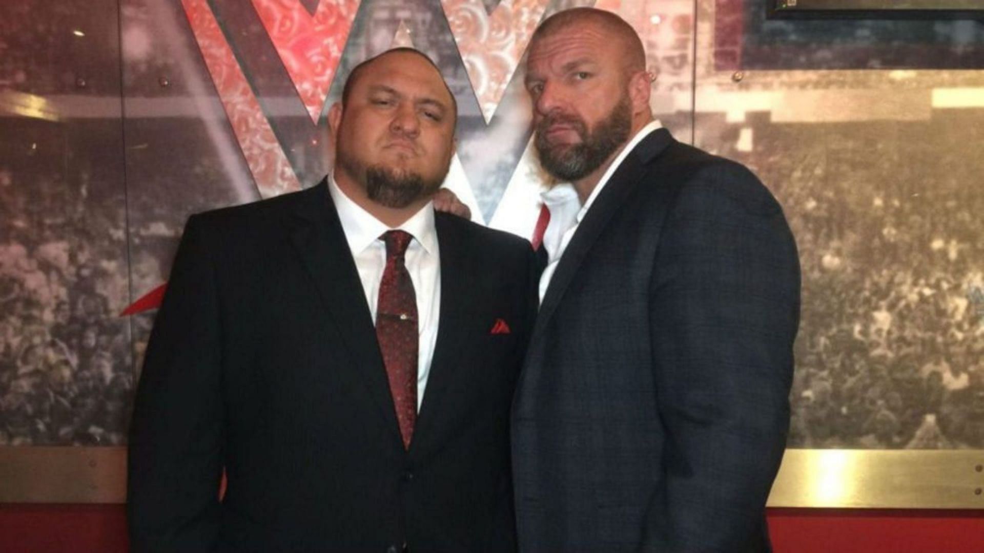Samoa Joe with Executive the Head of Creative Triple H