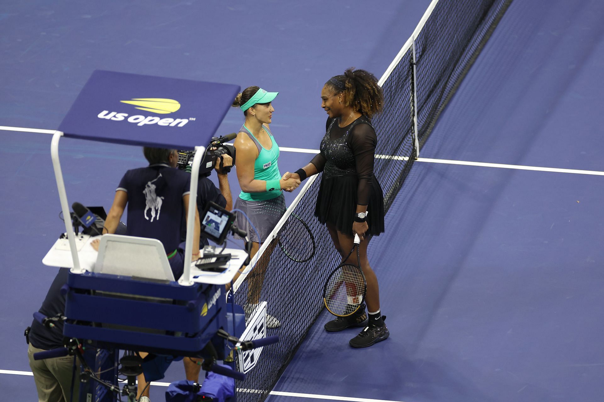 Serena Williams greets Kovinic (left) at the net.
