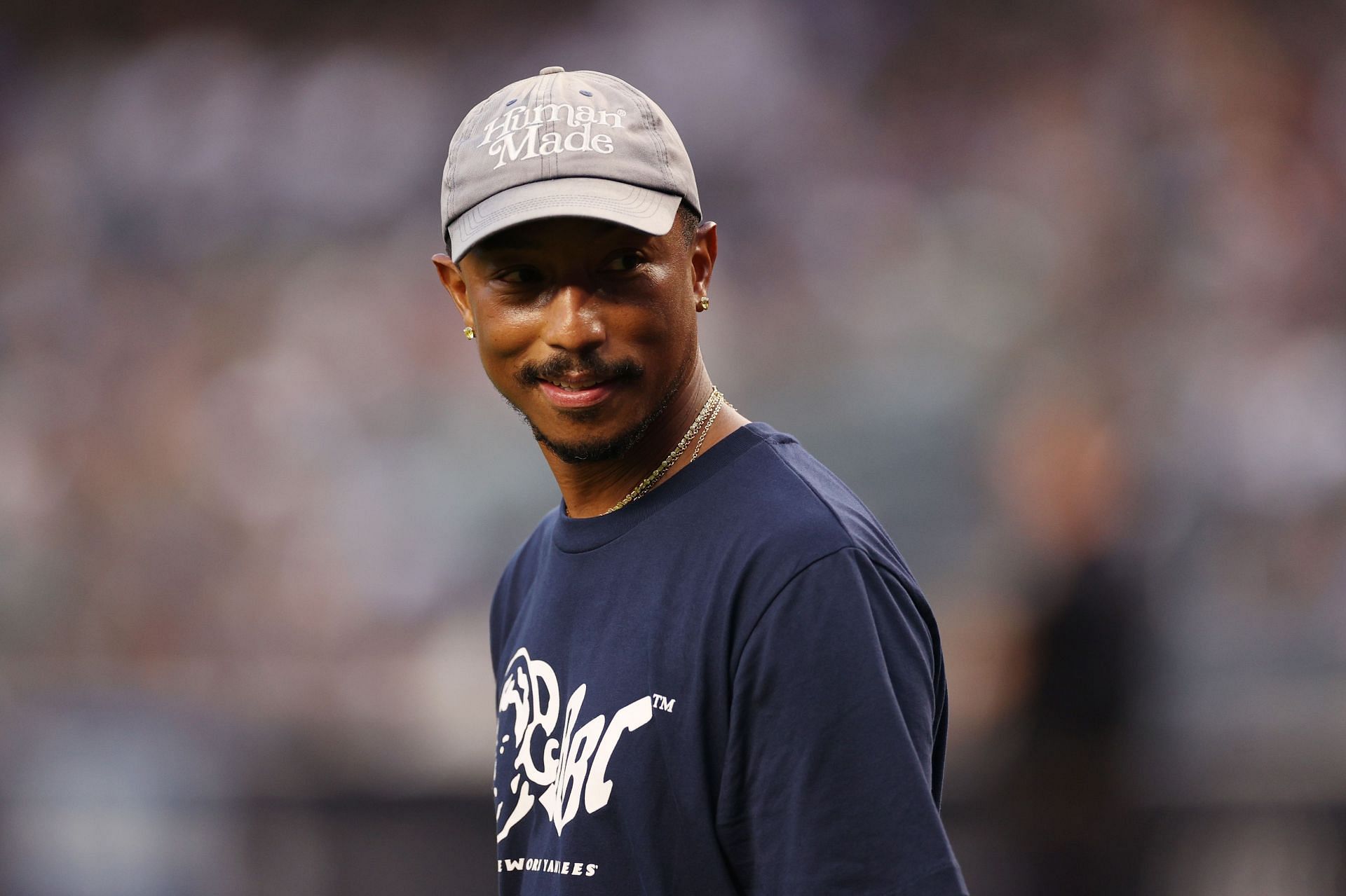Pharrell Williams Throws First Pitch at Yankees vs. Mets Game – WWD