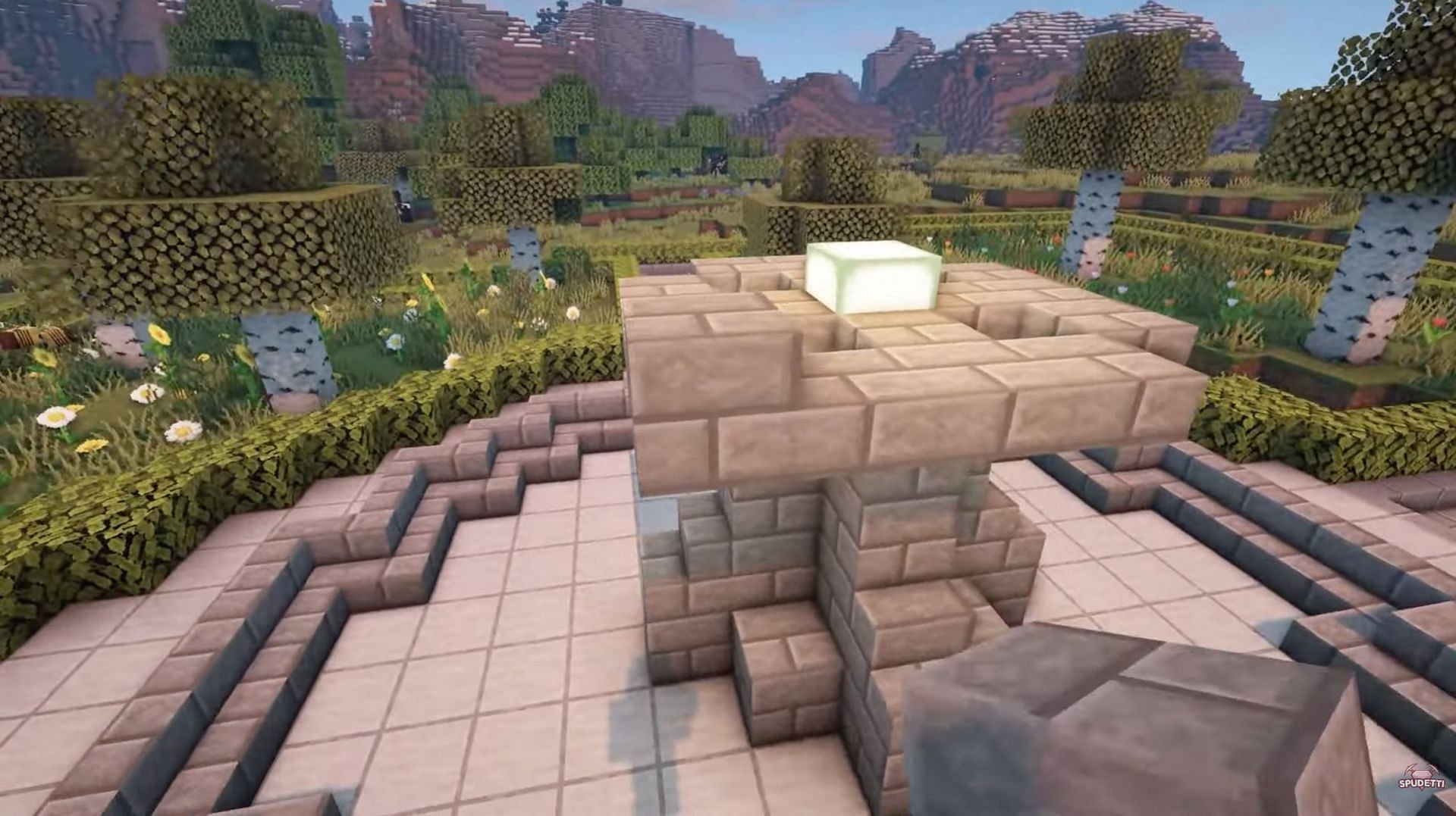 Stone brick stairs surround the slabs (Image via YouTube/Spudetti)