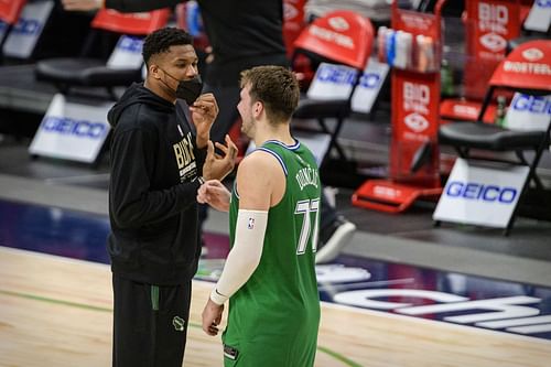 Giannis Antetokounmpo, left, of the Milwaukee Bucks with Luka Doncic of the Dallas Mavericks