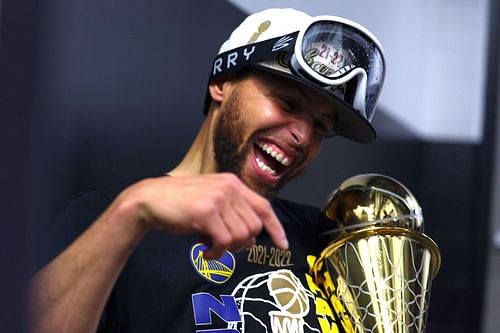 Steph Curry #30 of the Golden State Warriors celebrates with the Bill Russell NBA Finals Most Valuable Player Award after defeating the Boston Celtics 103-90 in Game Six of the 2022 NBA Finals at TD Garden on June 16, 2022, in Boston, Massachusetts.