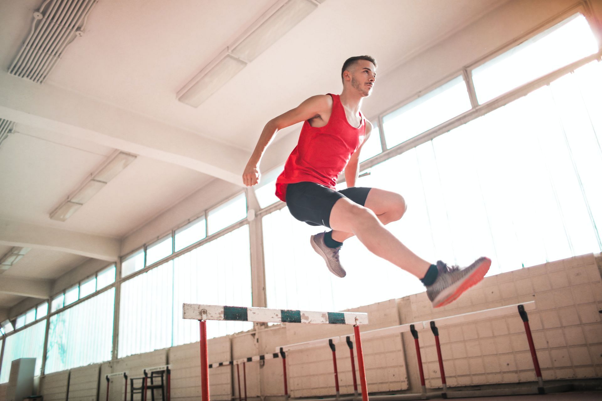 Incorporating hamstring workouts in your weekly schedule helps in improving long jump (Image via Pexels/Andrea Piacquadio)
