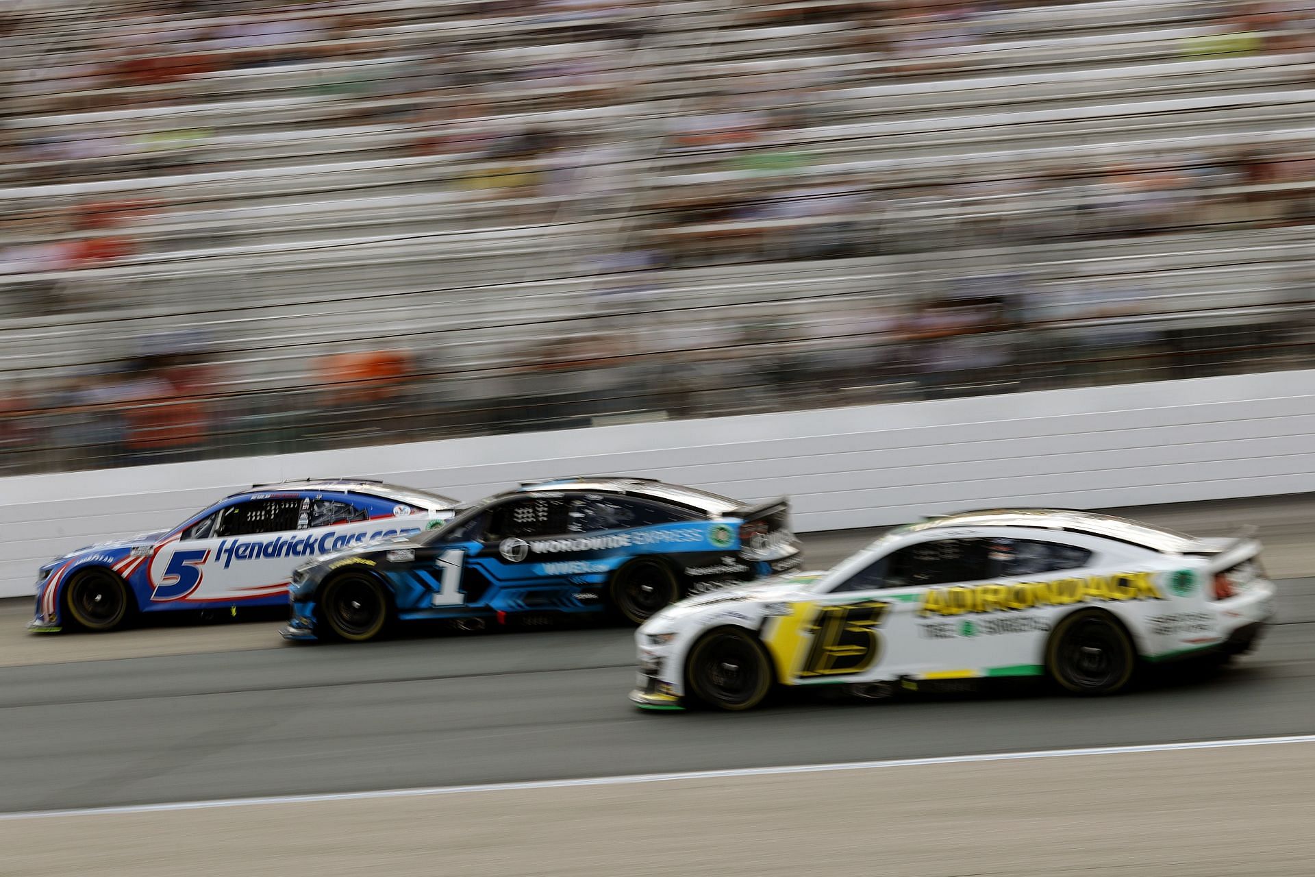Kyle Larson and Ross Chastain race during the NASCAR Cup Series Ambetter 301 at New Hampshire Motor Speedway