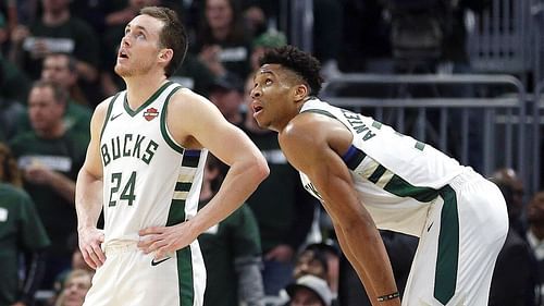 Milwaukee Bucks guard Pat Connaughton, left, and forward Giannis Antetokounmpo