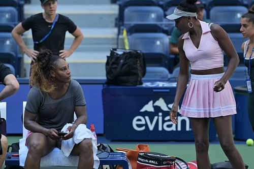 Venus and Serena practicing together on Arthur Ashe.