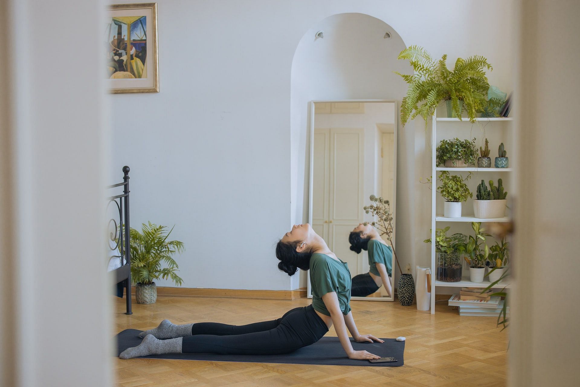 Certain yoga exercises can help improve your bone health. (Photo via Pexels/ Cottonbro)