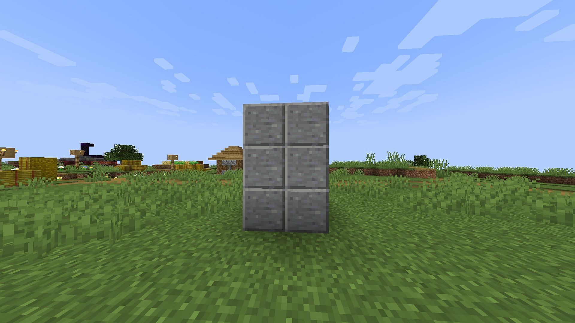 Players can use a wall like this to hide their door (Image via Mojang)