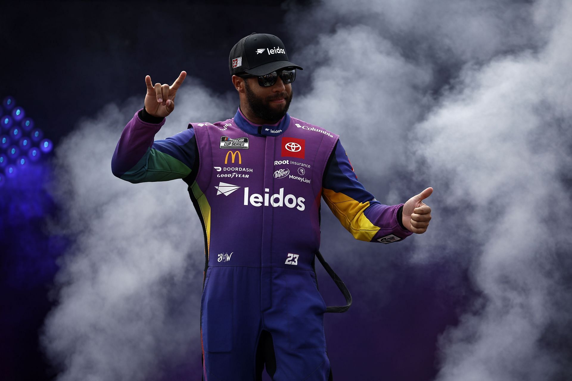 Bubba Wallace Jr. walks onstage during driver intros before the 2022 NASCAR Cup Series Federated Auto Parts 400 at Richmond Raceway in Richmond, Virginia (Photo by Chris Graythen/Getty Images)