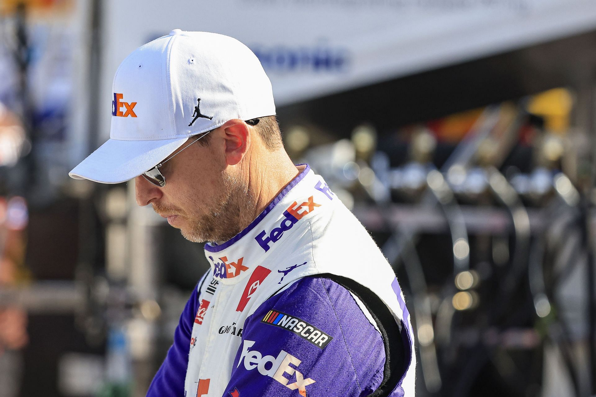 Denny Hamlin waits on the grid during practice for the NASCAR Cup Series Verizon 200 at the Brickyard at Indianapolis Motor Speedway