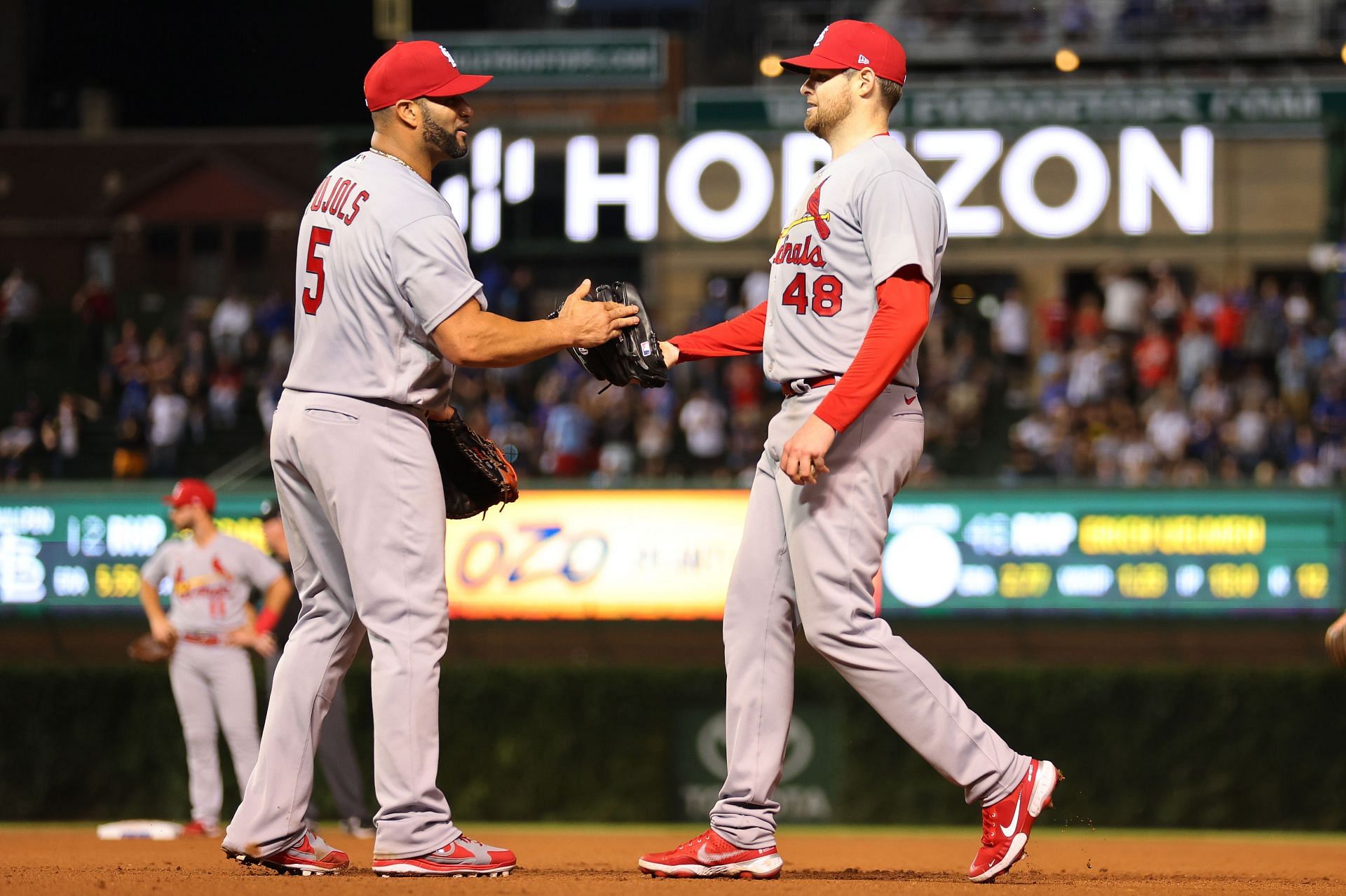 Jordan Montgomery celebrates with Albert Pujols after his complete game against the Chicago Cubs.