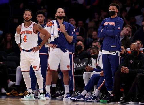 New York Knicks bench looks on at the game.