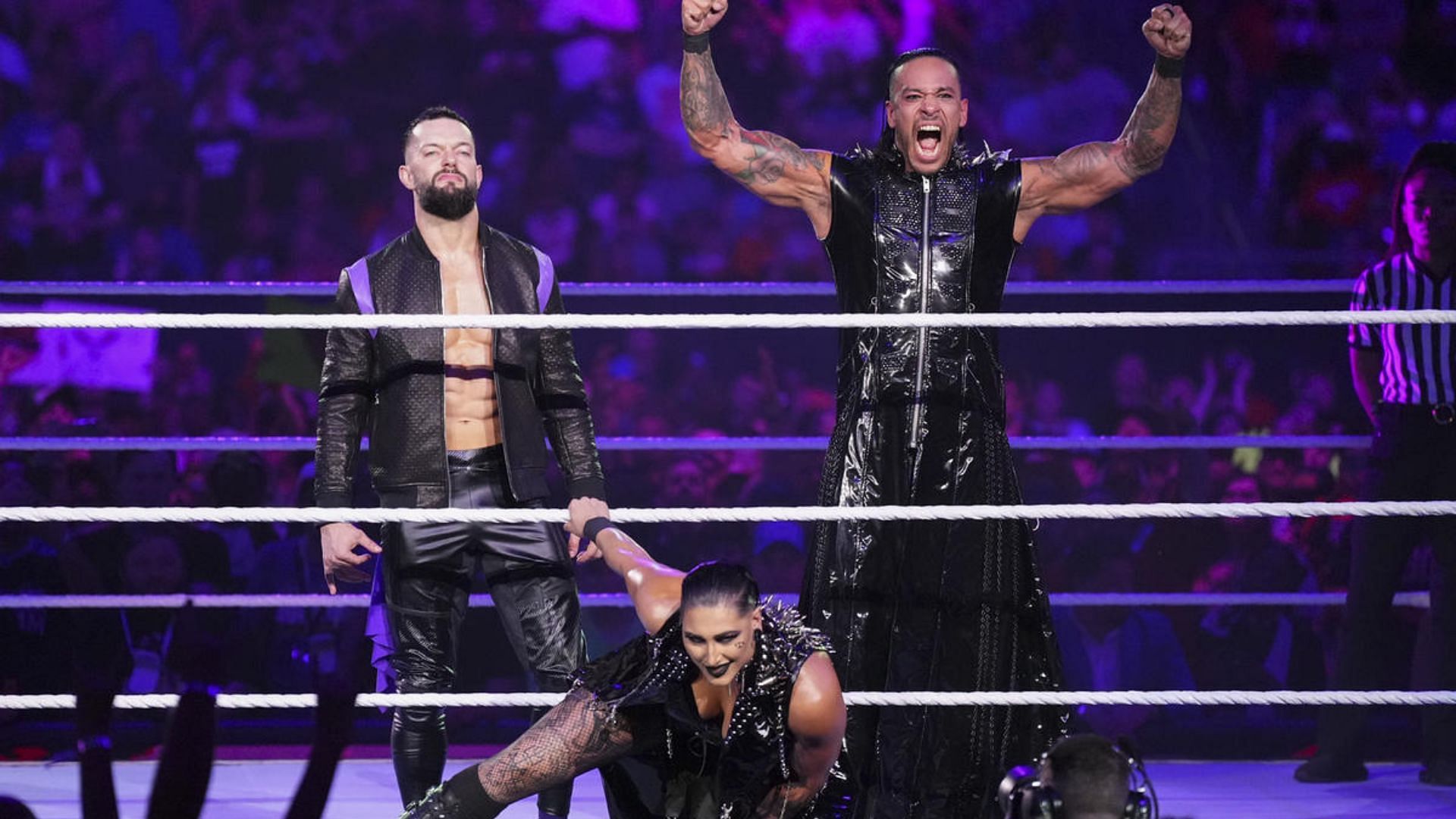 The Judgment Day&#039;s Finn Balor (left), Rhea Ripley (center), and Damian Priest (right)