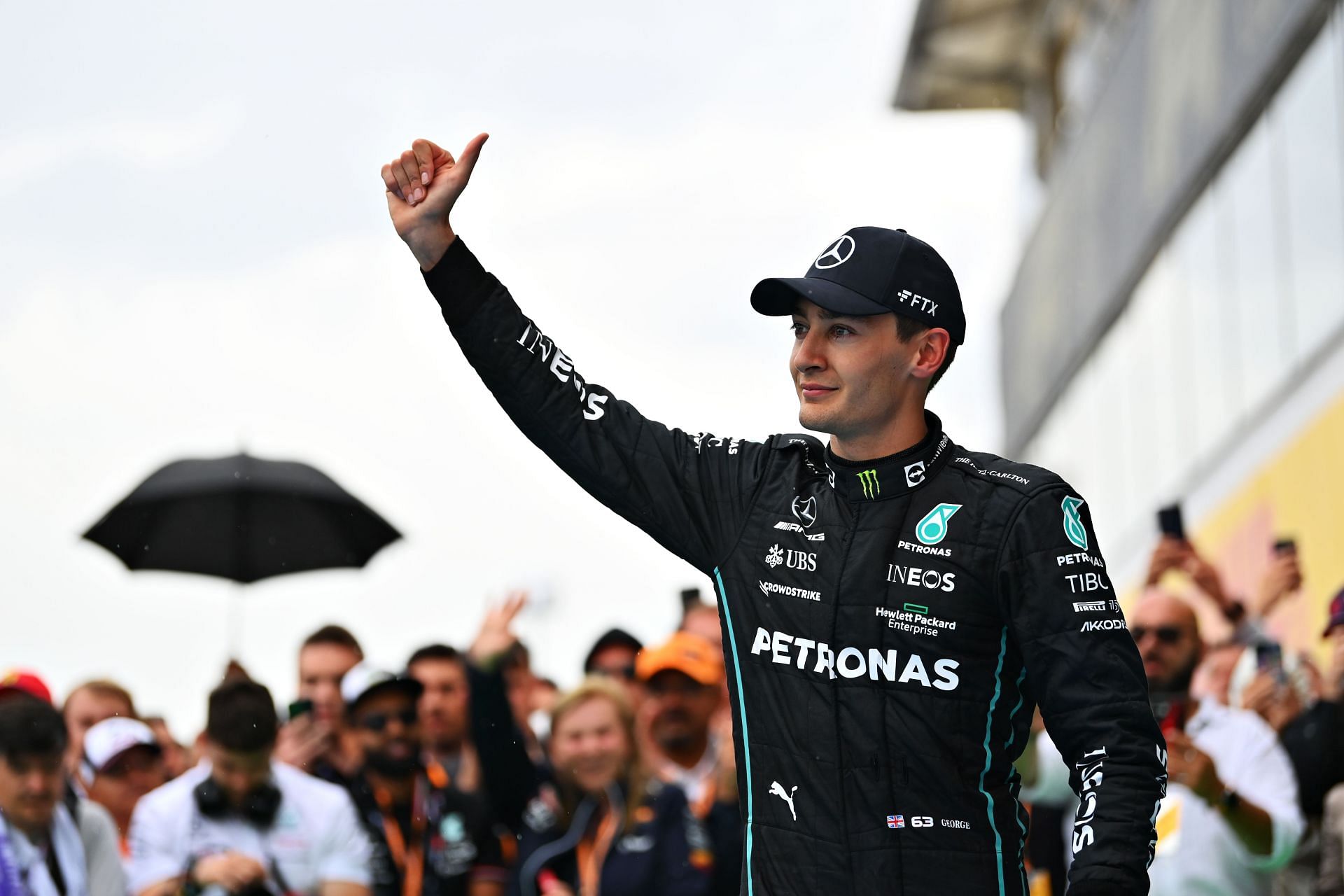 Mercedes driver George Russell gestures to the fans after his P3 finish at the 2022 F1 Hungarian GP (Photo by Dan Mullan/Getty Images)