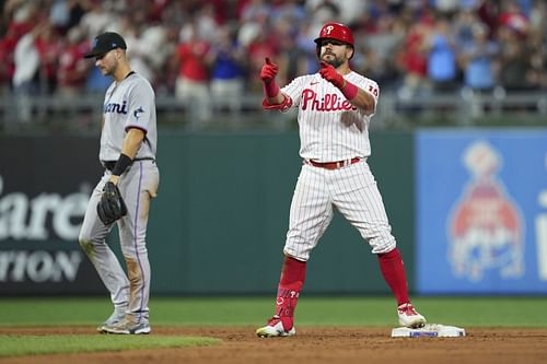 Kyle Schwarber of the Phillies reaches base in a game vs. the Marlins.