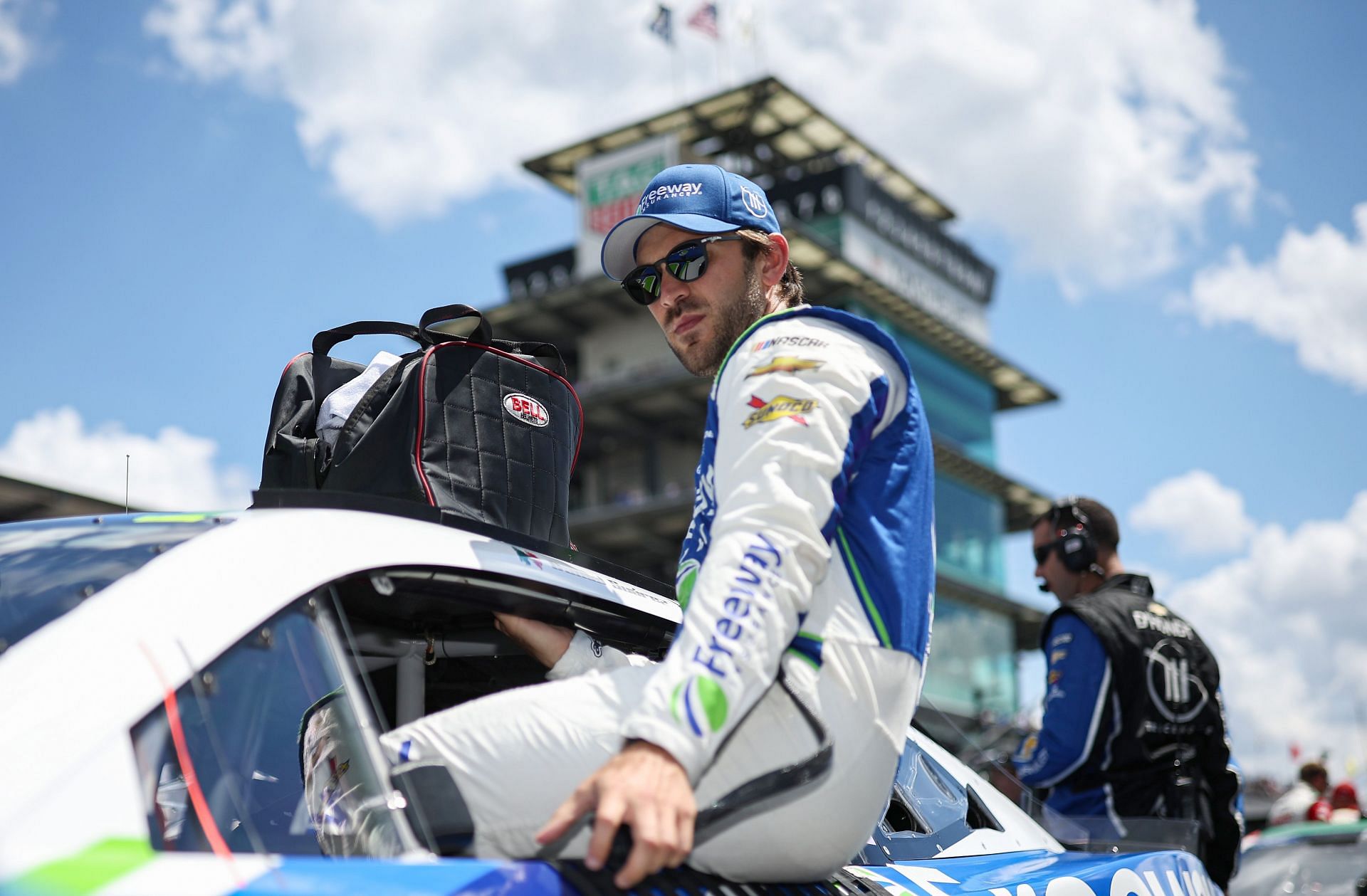 Daniel Suarez enters his car prior to the NASCAR Cup Series Verizon 200 at the Brickyard at Indianapolis Motor Speedway