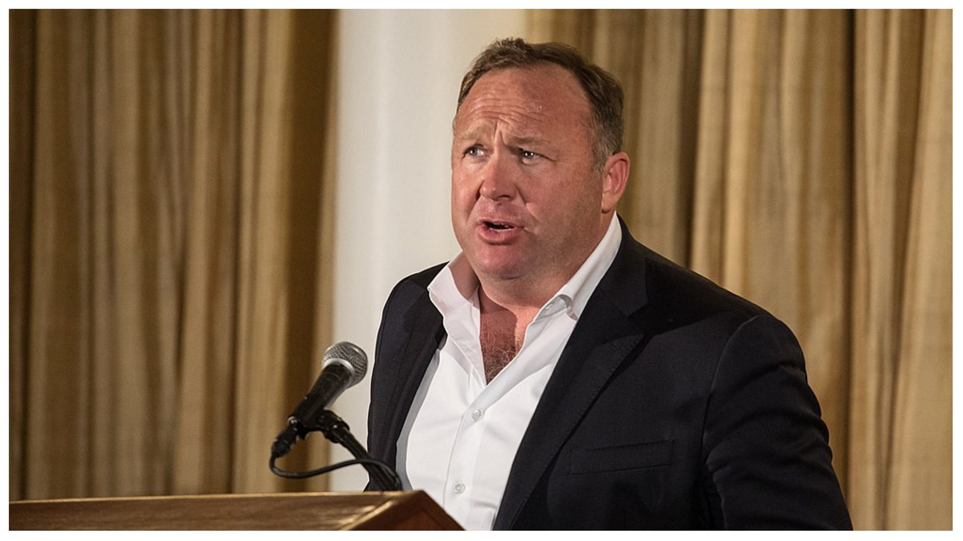 Alex Jones is slated to pay $4 million  (image via Jared L Holt/Wikipedia)