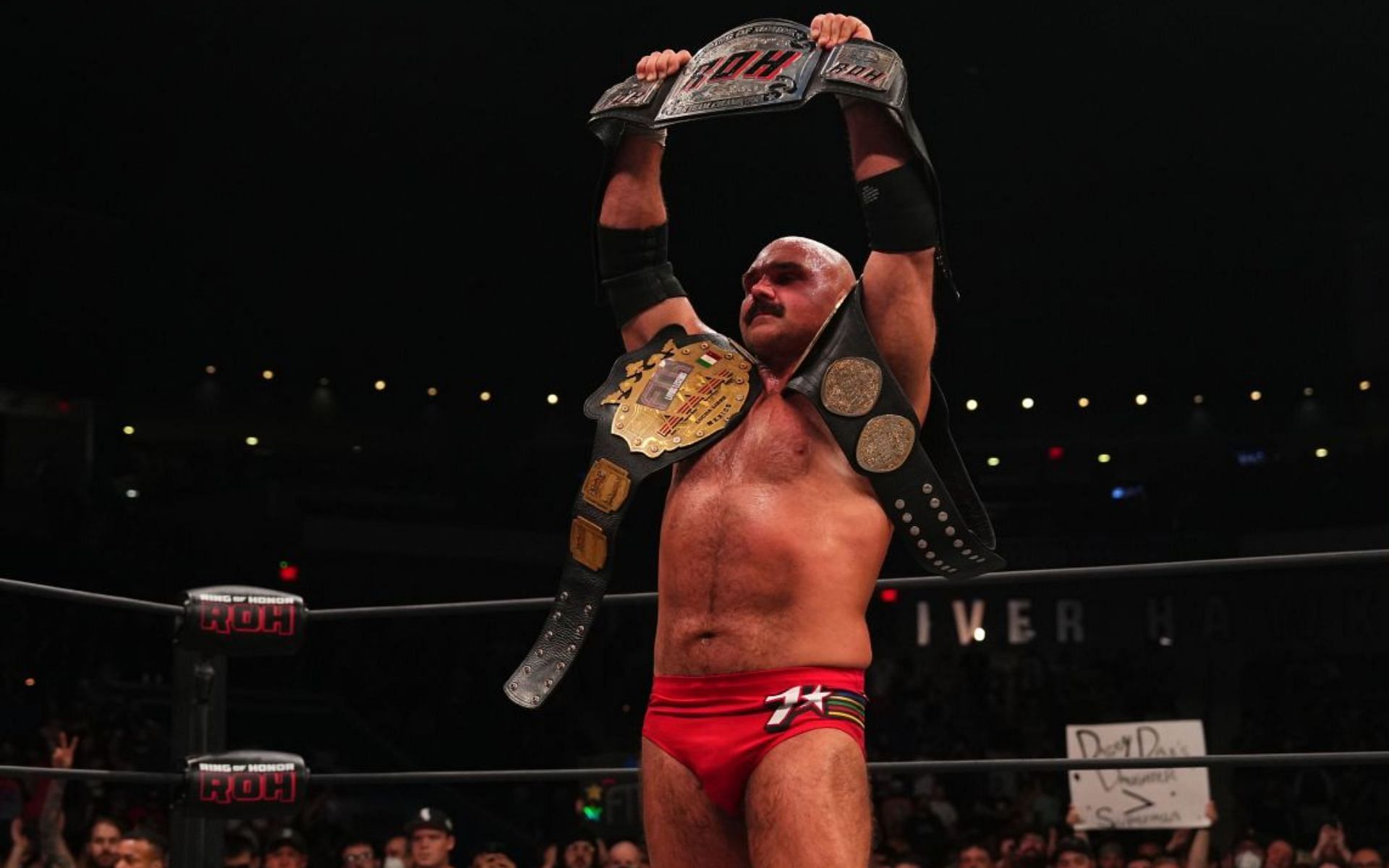 AEW star Dax Harwood with his triple tag team titles.