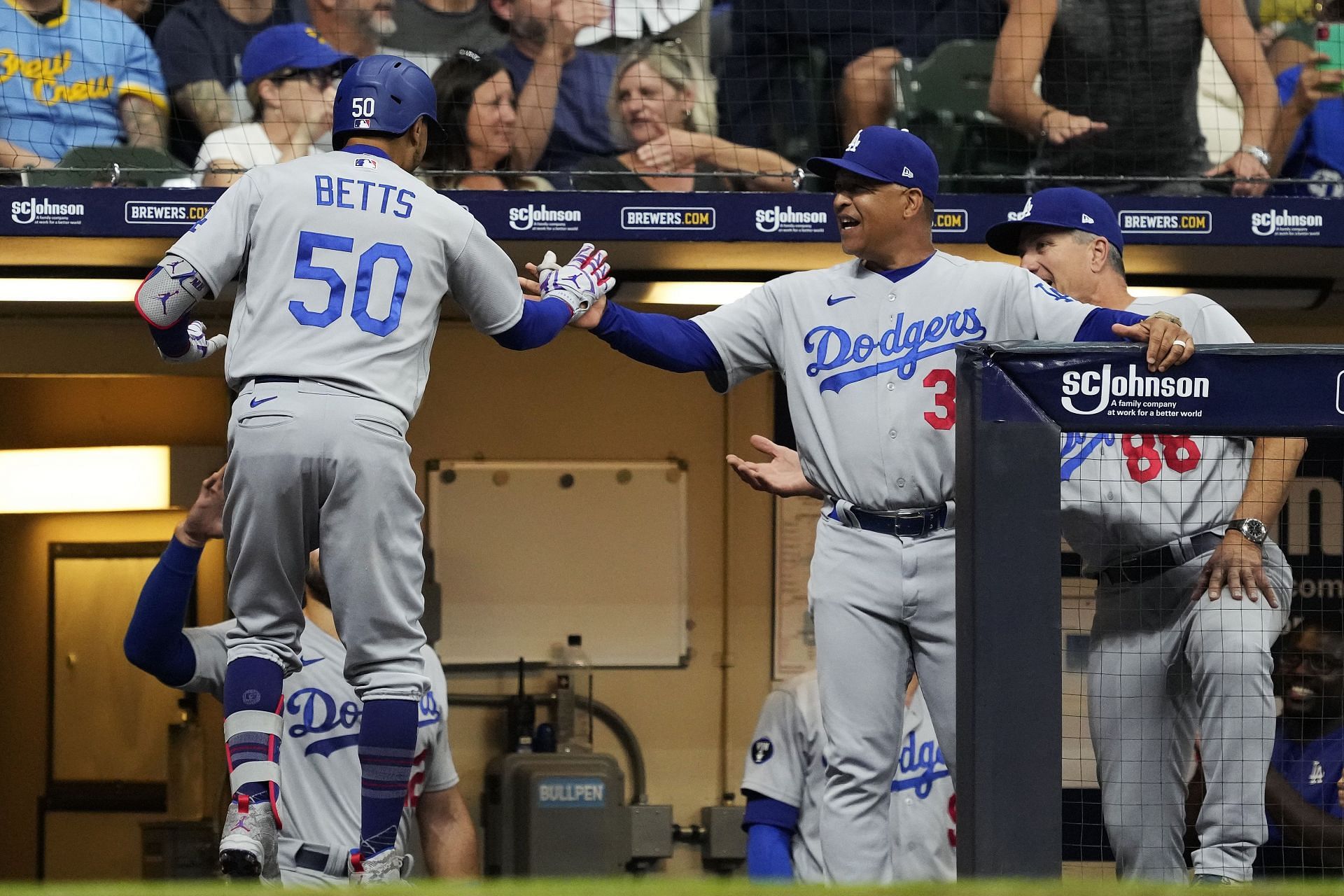 Mookie Betts celebrates with teammates following a solo home run during last night&#039;s MLB Los Angeles Dodgers v Milwaukee Brewers game.