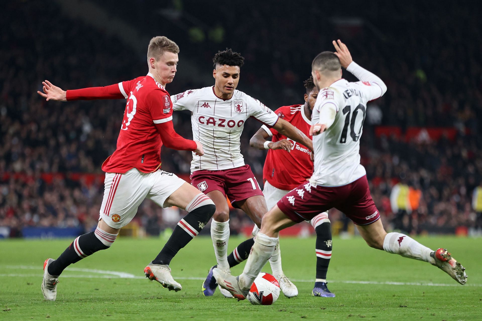 Fred and Scott McTominay tussling for the ball.
