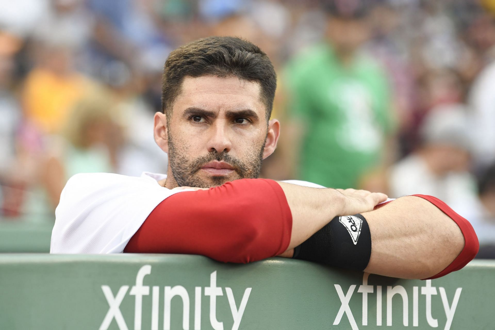 J.D. Martinez looks on from the dugout at Fenway Park during a New York Yankees v Boston Red Sox game.