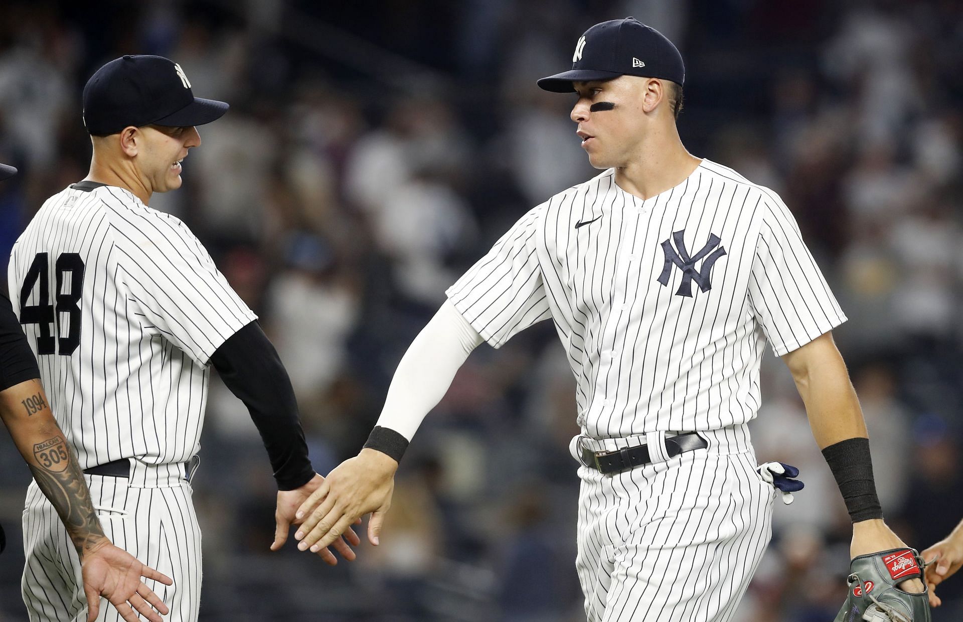 Aaron Judge and New York Yankees teammates celebrate a victory against the Seattle Mariners.