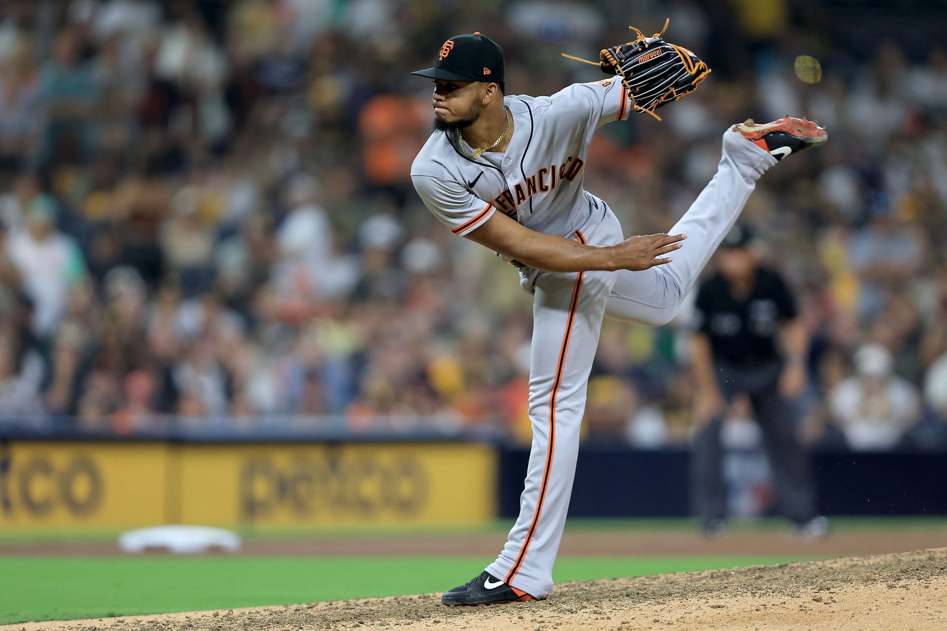 Camilo Doval #75 of the San Francisco Giants pitches during the ninth inning of a game against the San Diego Padres
