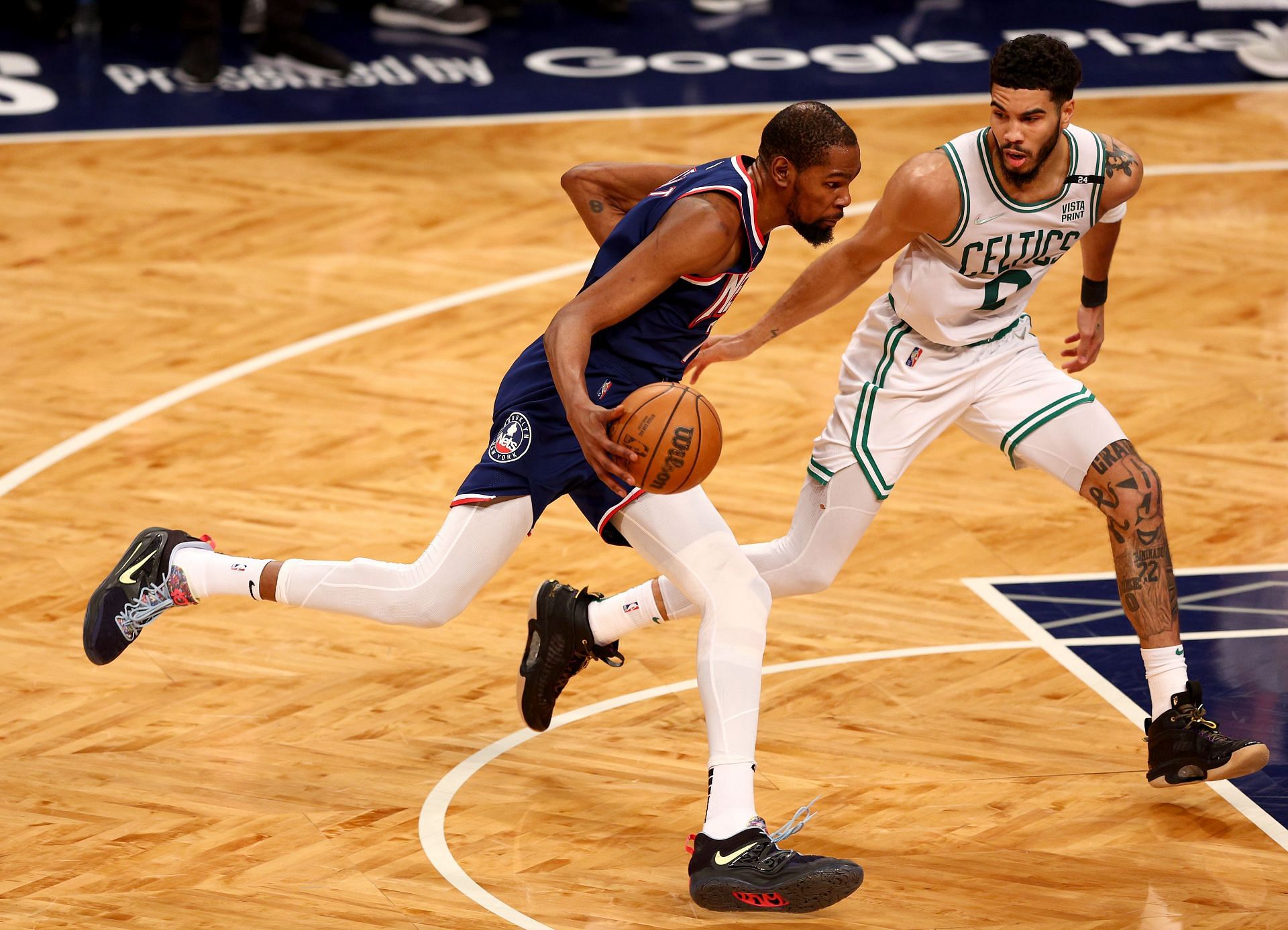 Kevin Durant of the Brooklyn Nets drives as Andre Drummond of the Brooklyn Nets defends during Game 4 of the first round of the Eastern Conference playoffs on April 25 in New York City.