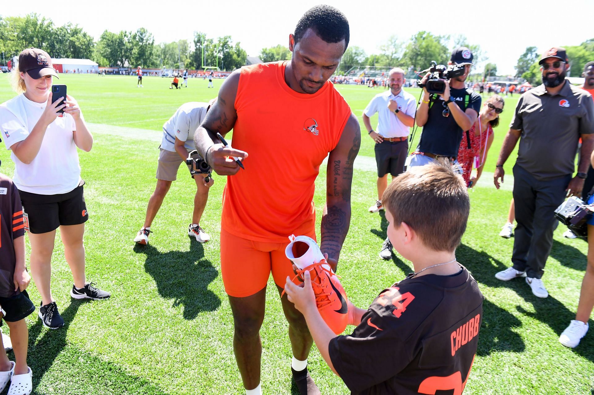 Cleveland Browns quarterback Deshaun Watson signs autographs during Training Camp