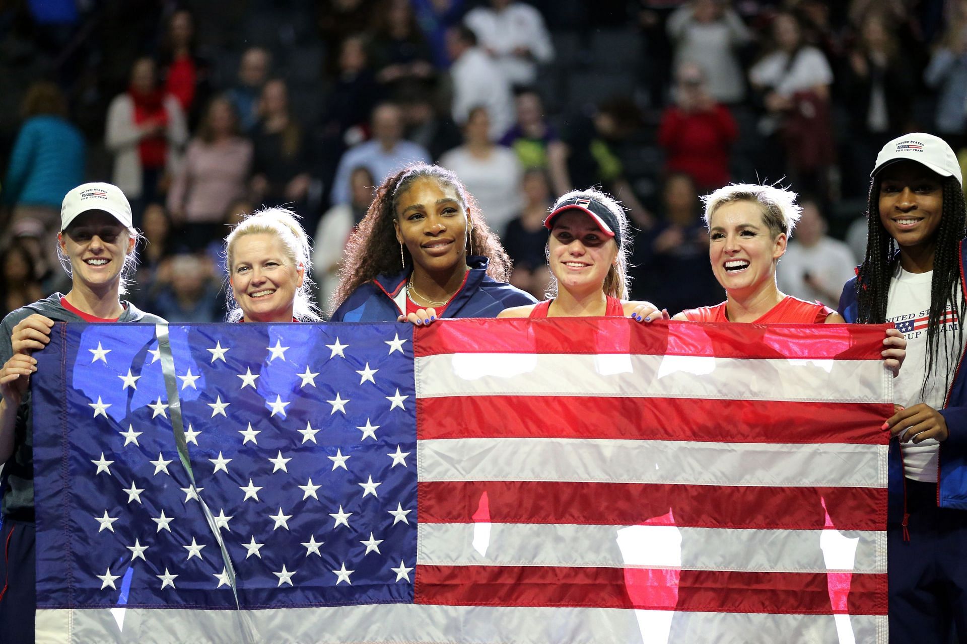 Coco Gauff (rightmost) and Serena Williams (third from left) pose for a photo with (L-R) Alison Riske, Kathy Rinaldi, Sofia Kenin and Bethanie Mattek-Sands in the 2020 Fed Cup.