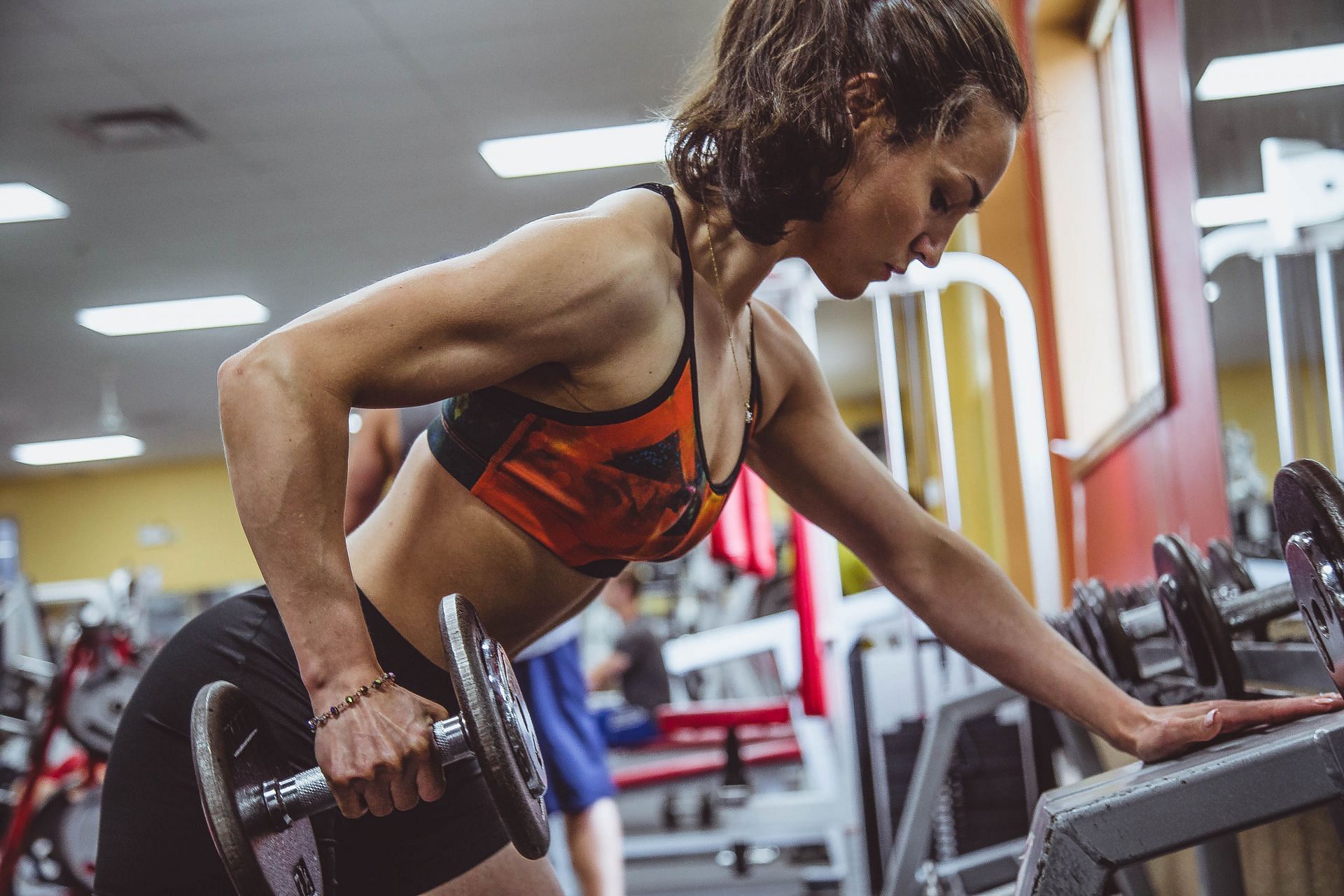Arm toning exercises women can include in their workout (Image via Unsplash/Alora Griffiths)