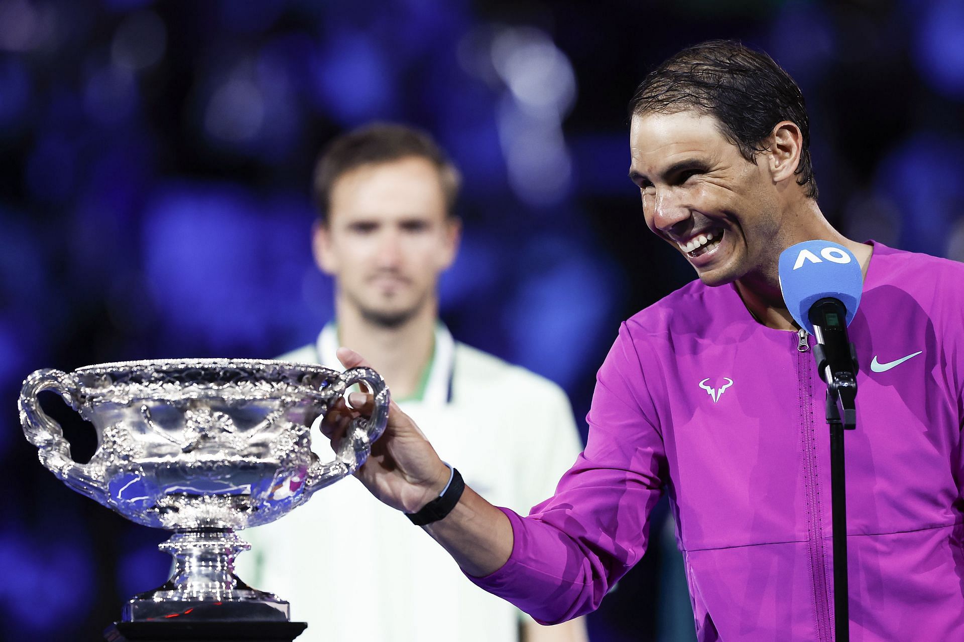 Rafael Nadal (in purple) and Daniil Medvedev after the 2022 Australian Open final.