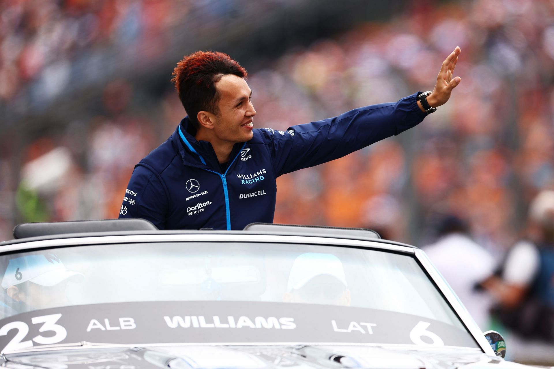 Williams&#039; Alex Albon waves to fans during the drivers&#039; parade ahead of the 2022 F1 Hungarian GP (Photo by Francois Nel/Getty Images)