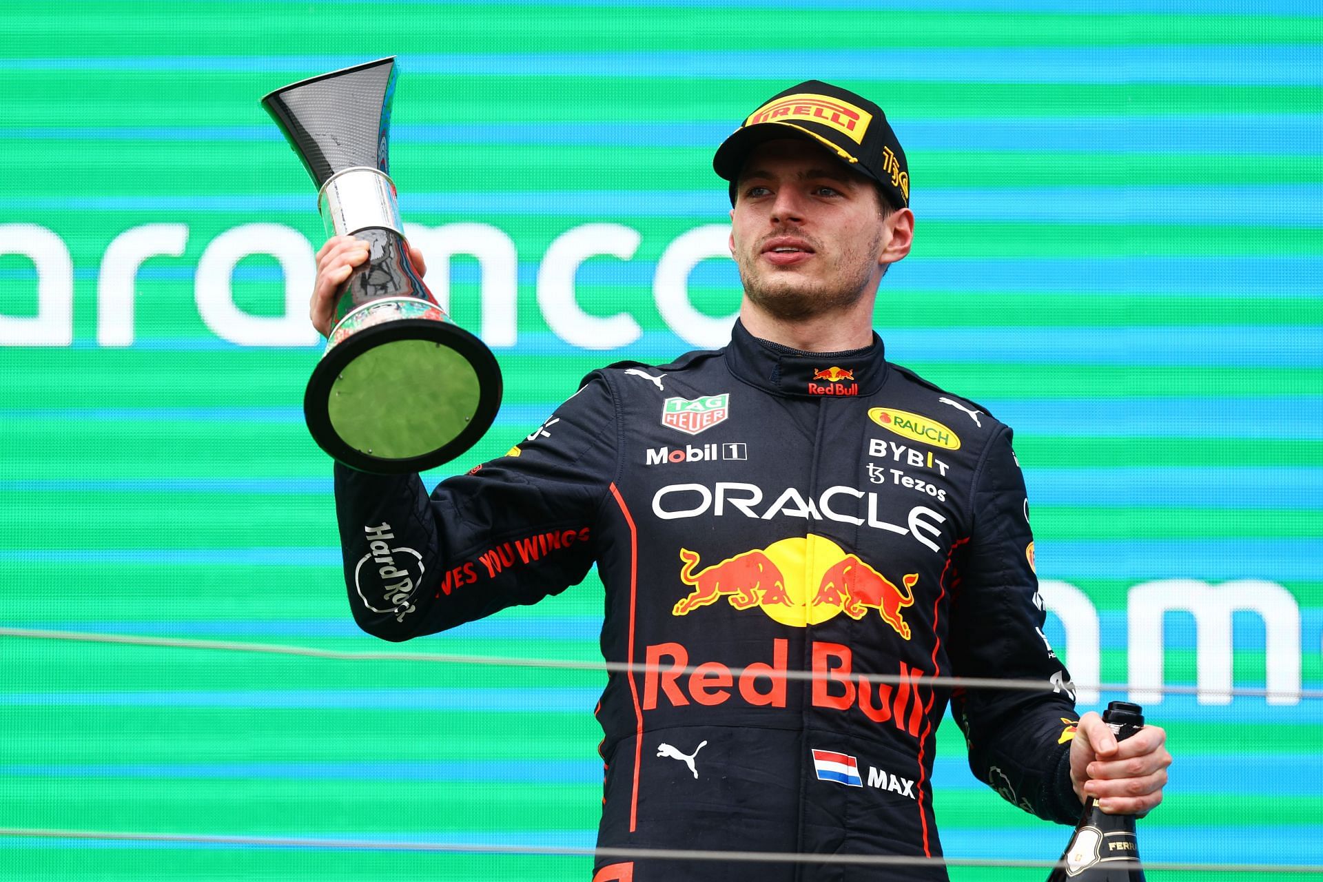 Max Verstappen celebrates on the podium after winning the F1 Hungarian Grand Prix at Hungaroring in Budapest, Hungary (Photo by Francois Nel/Getty Images)
