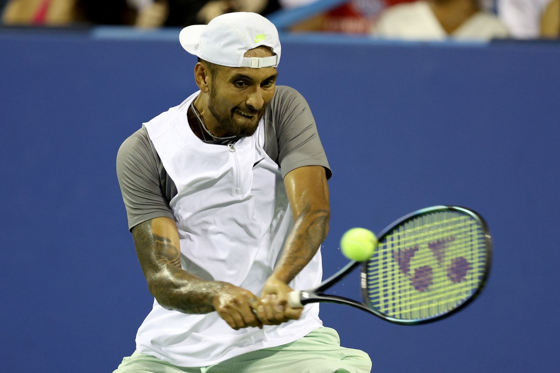 Nick Kyrgios strikes a backhand against Tommy Paul in their second round encounter in the Citi Open.