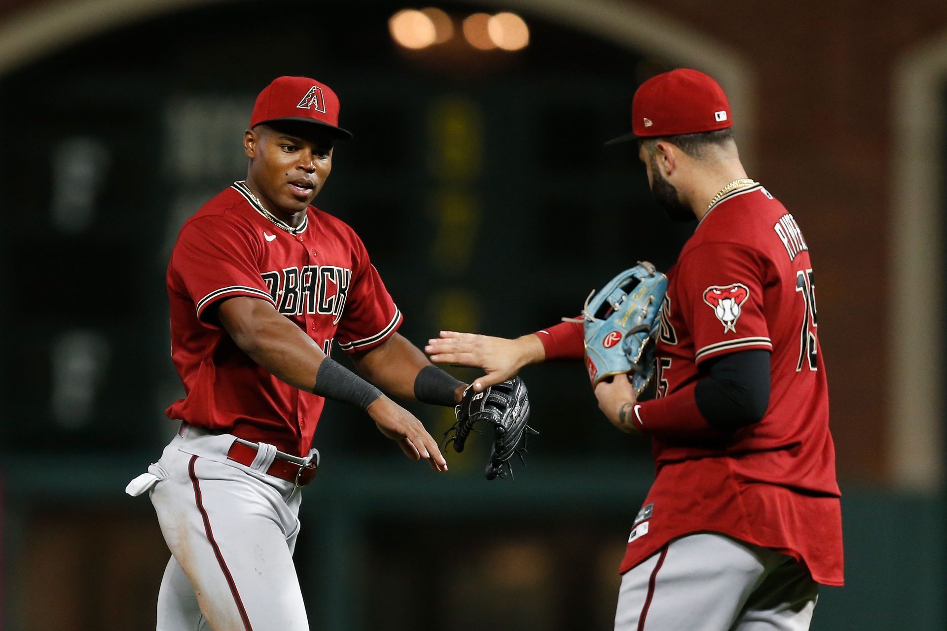 Stone Garrett (left) and Emmanuel Rivera (right) celebrate after beating the San Francisco Giants on August 17th in San Francisco, California.