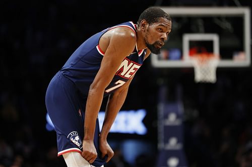 Kevin Durant looks on at a Nets game