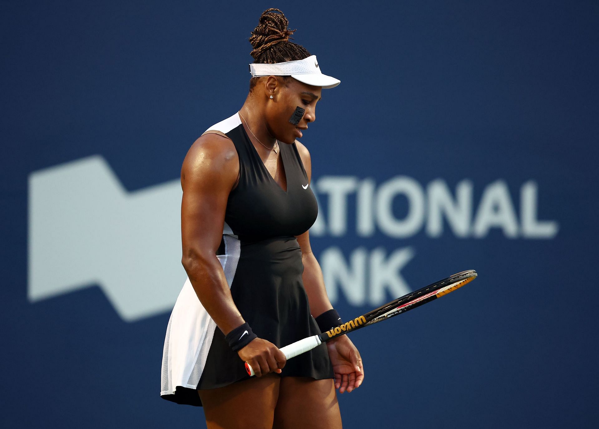 Serena Williams of the United States looks at her racket at the National Bank Open Toronto - Day 5