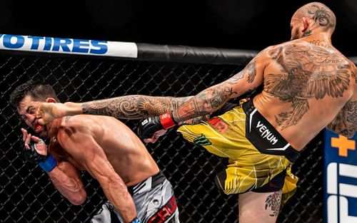 Marlon Vera lands a head kick against Dominick Cruz [image courtesy of @SandhuMMA/Twitter]