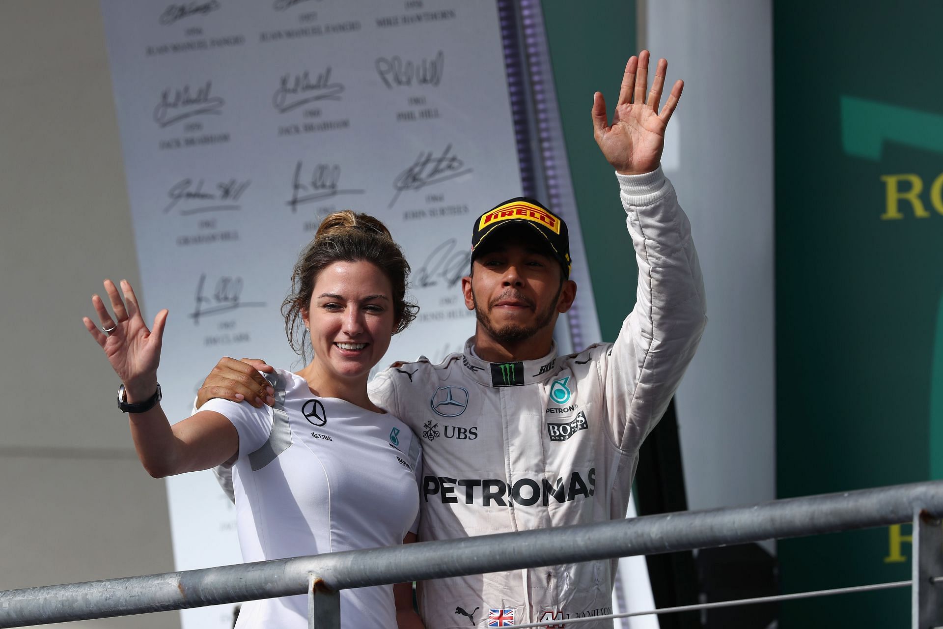 Lewis Hamilton celebrates his win with Victoria Vowles on the podium during the United States Formula One Grand Prix at Circuit of The Americas on October 23, 2016, in Austin, United States (Photo by Clive Mason/Getty Images)