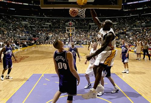 Shaquille O'Neal of the LA Lakers dunks all over the Utah Jazz