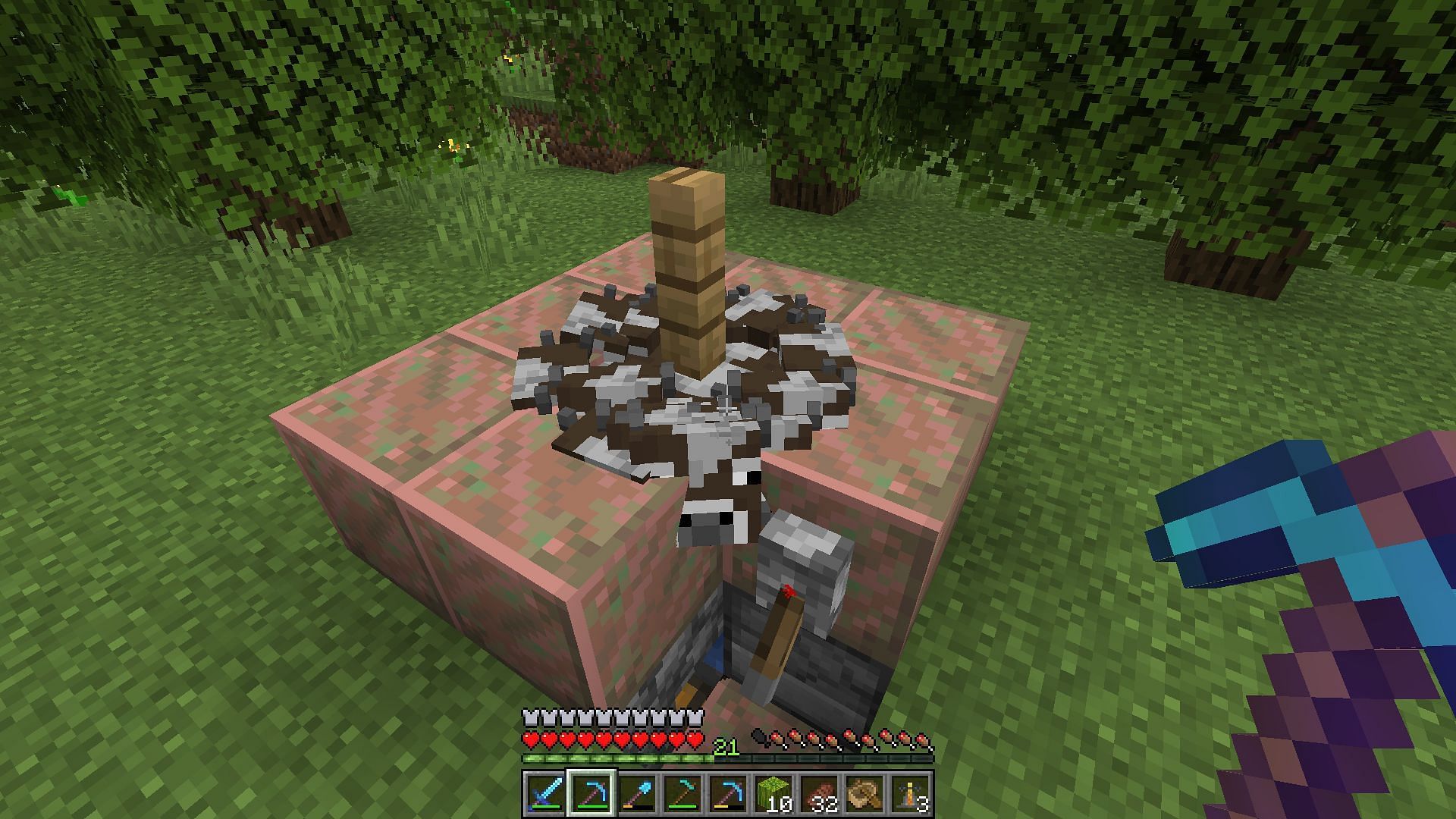 A cow crusher on a survival world (Image via Minecraft)