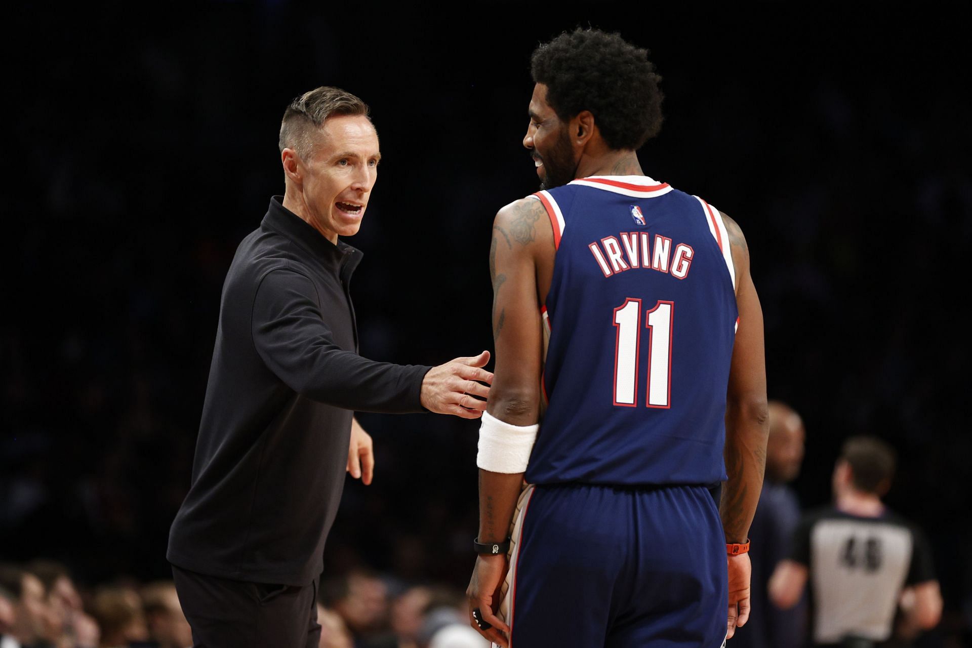 Head coach Steve Nash of the Brooklyn Nets talks with Kyrie Irving #11 during the first half against the Cleveland Cavaliers at Barclays Center on April 08, 2022, in the Brooklyn borough of New York City