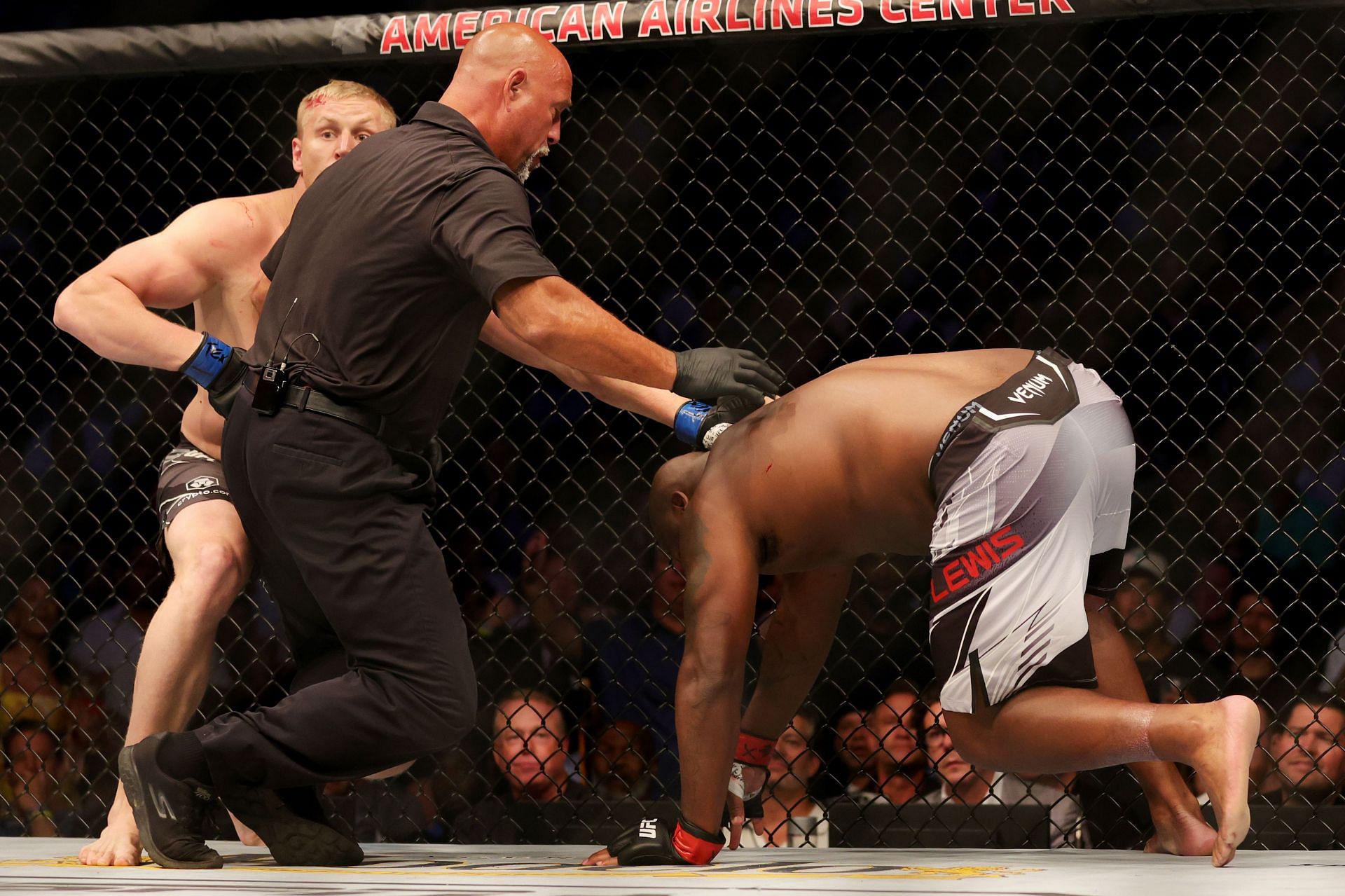 Some fans felt that referee Dan Miragliotta (middle) stopped the bout between Derrick Lewis (R) and Sergei Pavlovich (L) too soon