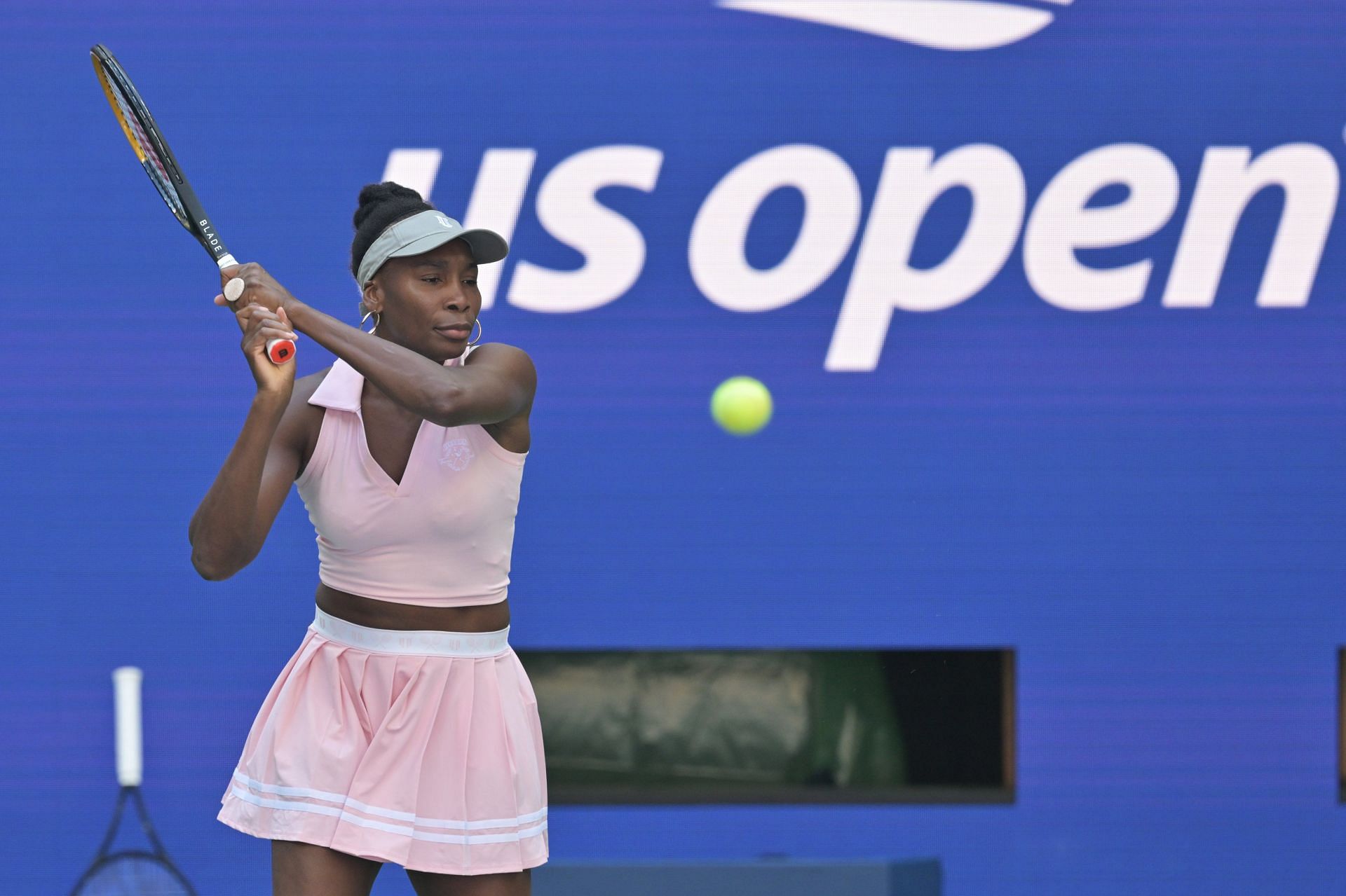 Venus Williams strikes a backhand during practice.