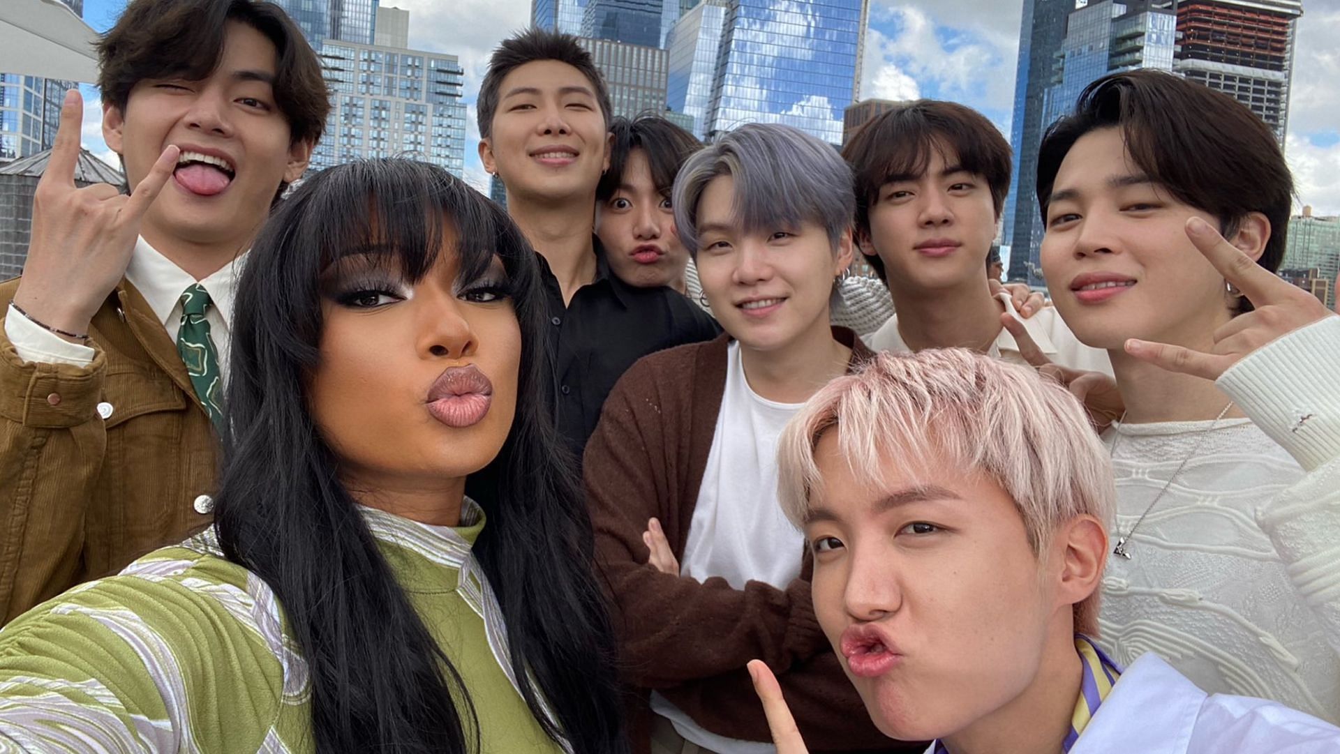 A still of the K-pop group BTS with American singer/rapper Meghan Thee Stallion. (Image via Twitter/@theestallion)