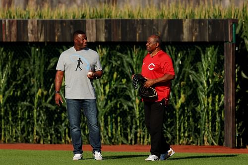 Ken Griffey Jr. (L) and his father Ken Griffey Sr. take the field before the game between the Chicago Cubs and the Cincinnati Reds at Field of Dreams on August 11, 2022 in Dyersville, Iowa.