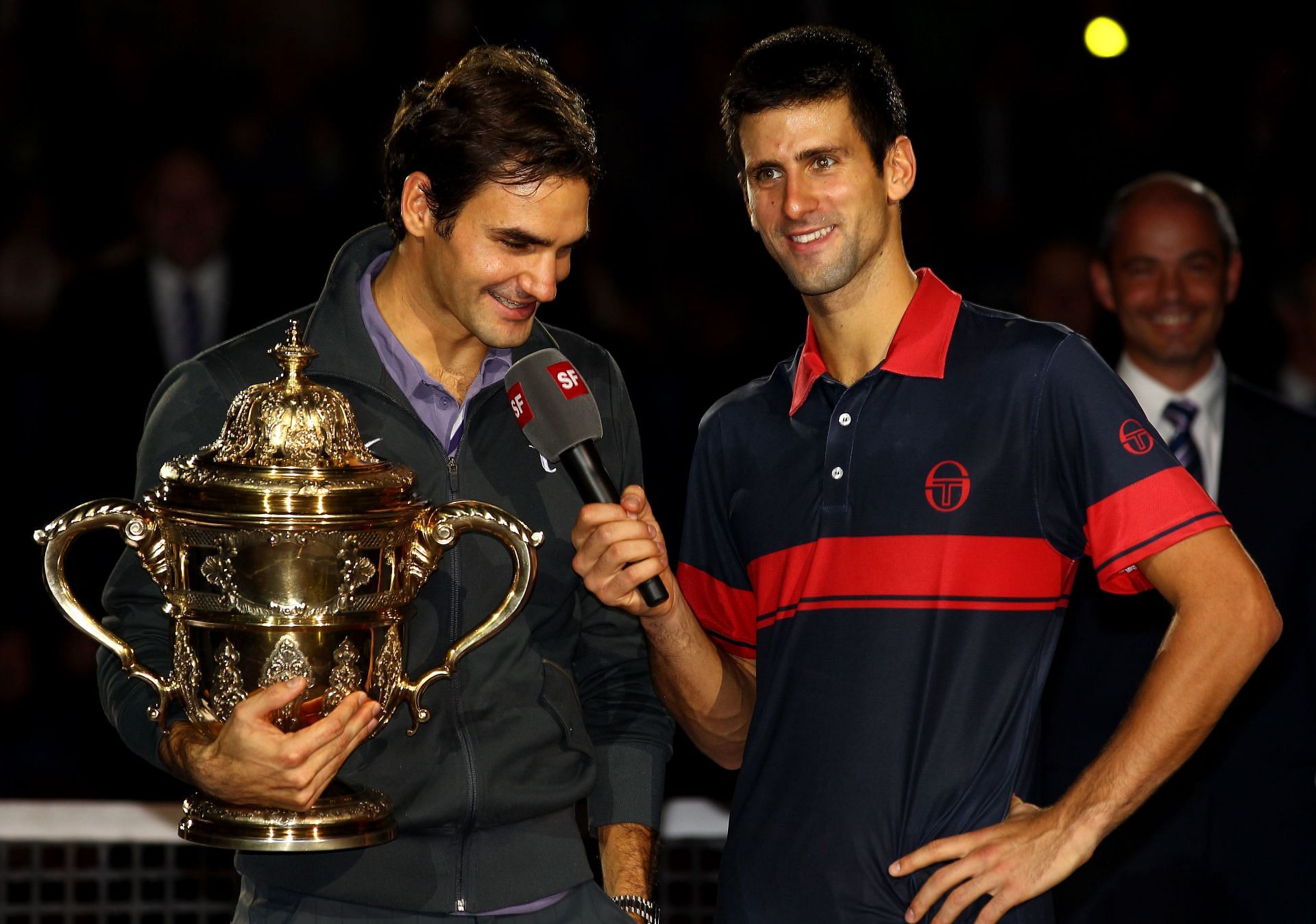 Davidoff Swiss Indoors - Novak Djokovic shares a light moment with Roger Federer after the 2007 finals