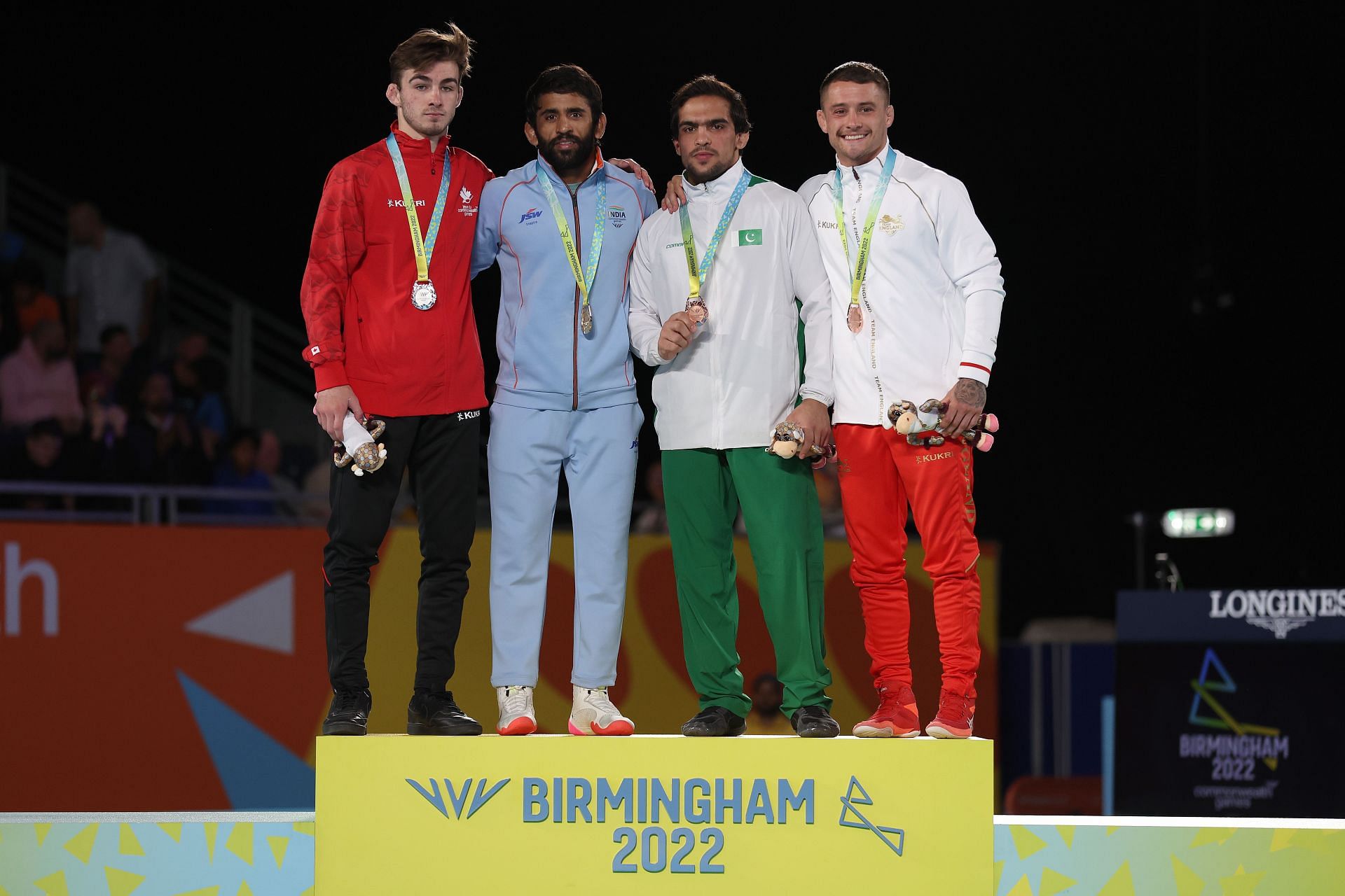 Indian wrestler Bajrang Punia (2nd from L) on the podium at the 2022 Commonwealth Games (Image courtesy: Getty)