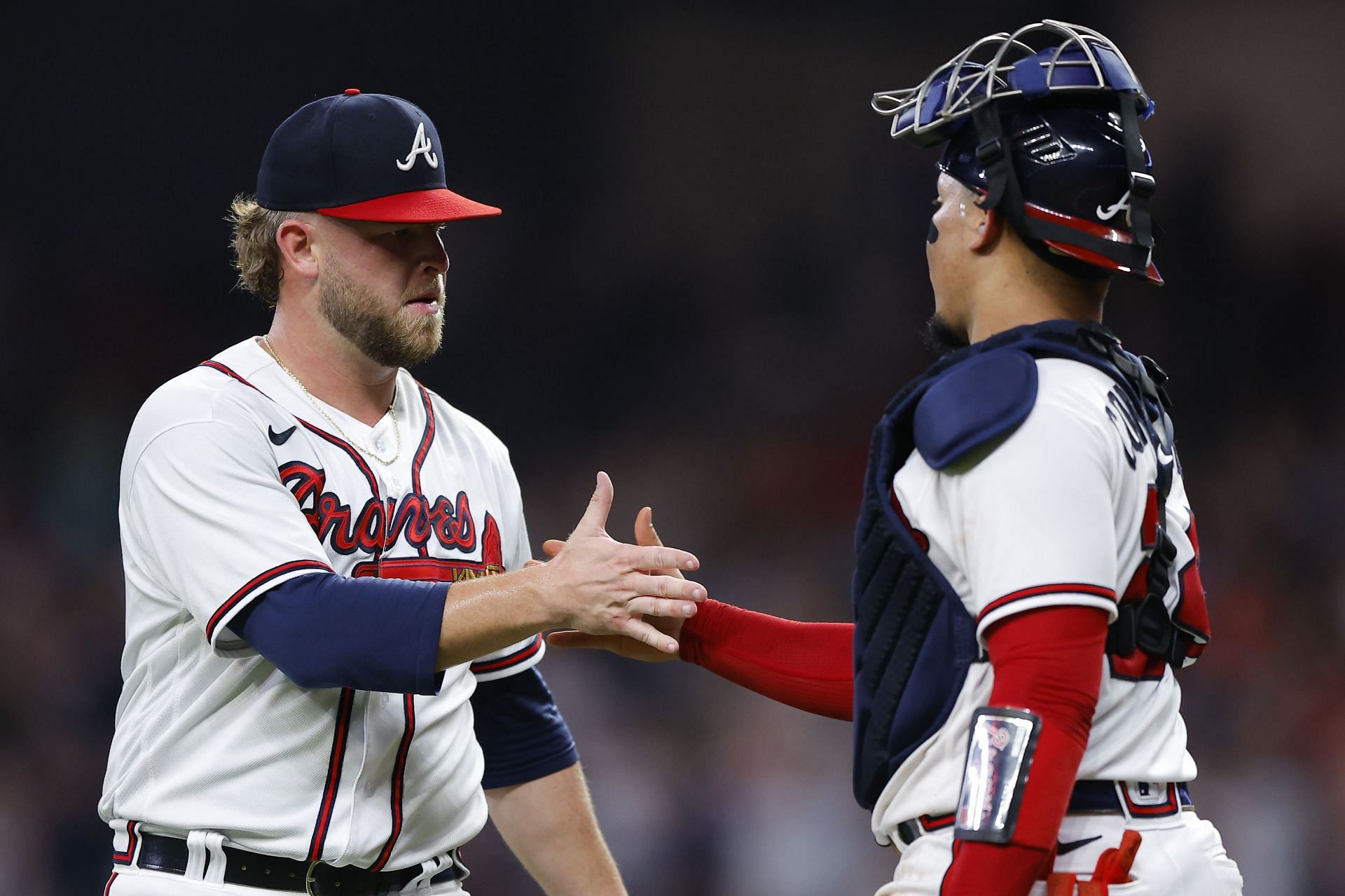 A.J. Minter and William Contreras of the Atlanta Braves celebrate a victory.